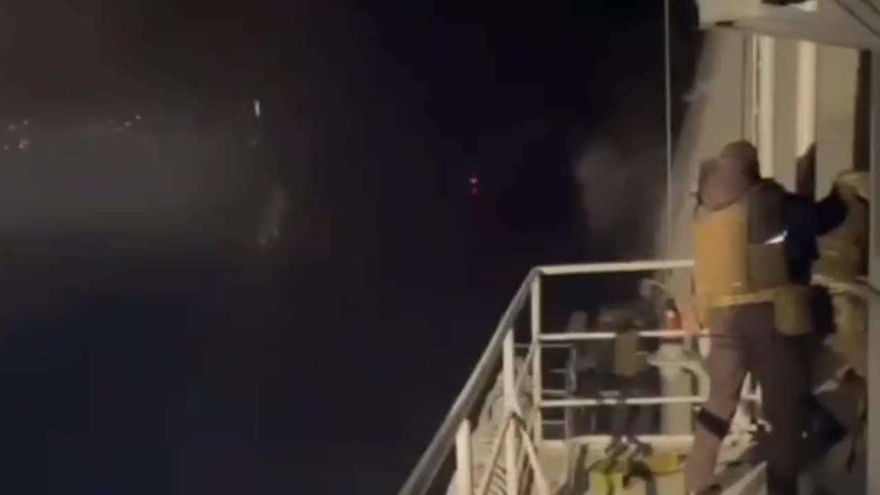 Soldiers on a Russian battleship destroy suicide boats, one of which harm their ship