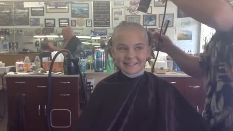 12 year old shaves head for cancer awareness