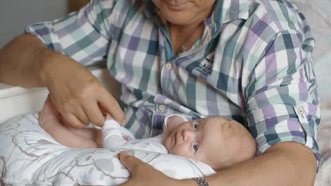 Grandfather holding a baby