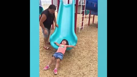 The baby fell down on the slide