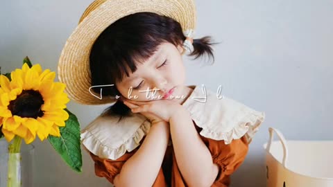 Super cute baby holding sunflower