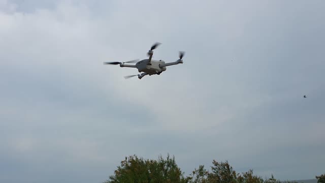 My DJI Mini 3 pro drone flying in the sky doing its thing on a windy day Walton On The Naze Essex
