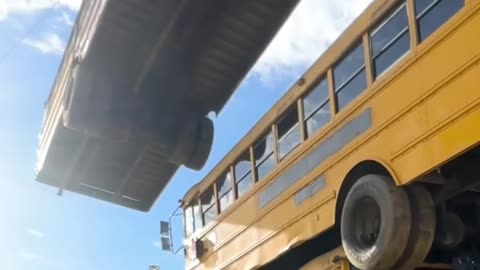 How many school buses can we stack?