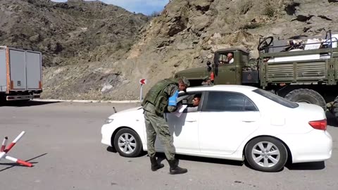 Russian peacekeepers provide security for civilians leaving Nagorno-Karabakh