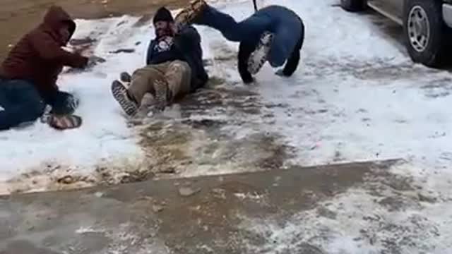 Men Slip And Fall on Ice While Running Away From Paintball After Playing Spin The Bottle