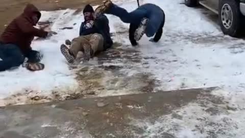 Men Slip And Fall on Ice While Running Away From Paintball After Playing Spin The Bottle
