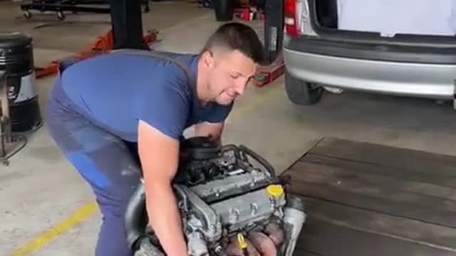 Car repairers install car engines.