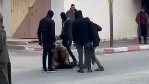 Hamas security forces whipping an elderly Gazan man.