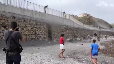 Migrant boy swims to beach in Spain's Ceuta with plastic bottles to stay afloat