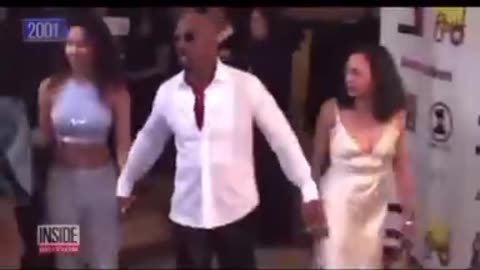 Montel Williams and his THOT Kamala Harris back in 2001. She...he...it has come a long way