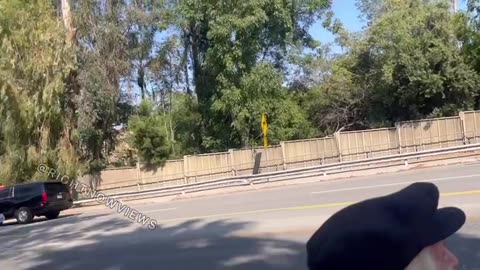 Supporters of President Trump line the streets near Beverly Hills, eagerly waving