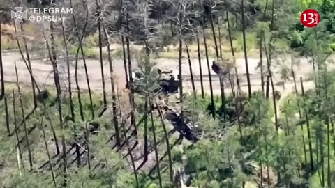 After the battle, Russians seek to load the dead and wounded into armored vehicles