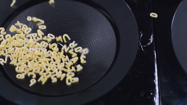 Pasta alphabet letters are dancing!