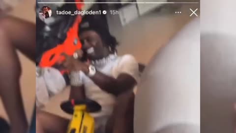 Chief Keef riding a go kart around his home