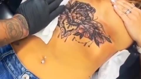 Tatoo on beautiful girl chest