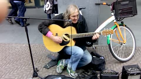 American street musician in Holland plays Sultans of Swing