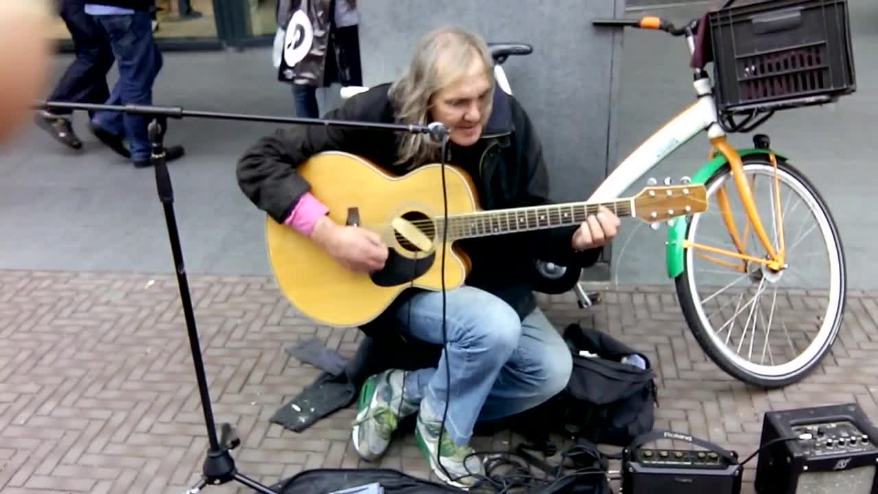 American street musician in Holland plays Sultans of Swing