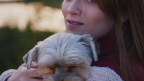Beautiful Woman with a Cute Dog on her Shoulders