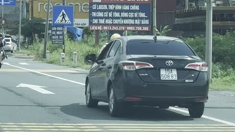 Police Officer Rides On Car Hood