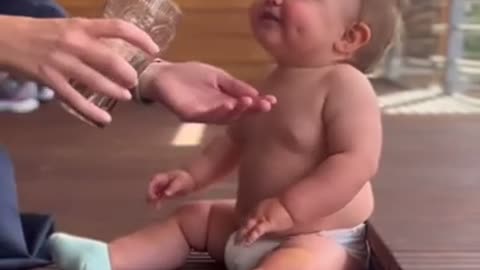 Cute Toddler can´t Stop Laughing while drinking