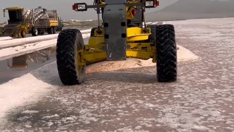 Blading the SaltMaking Wind Rows