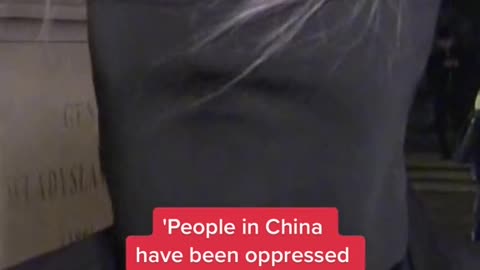Woman interviewed at China lockdown protest.