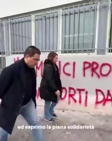 Italians use blood red spray paint on central health building over the Covid-19 bio-weapons symbol