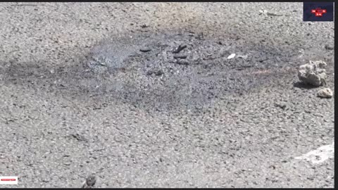 Ukrainian police retrieve missile fragment wreckage from busy Kyiv street