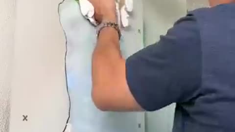 He fixes the hole in the wall! 👊