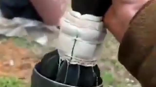 Ukrainian assault team using a 82mm mortar system in the Donbas