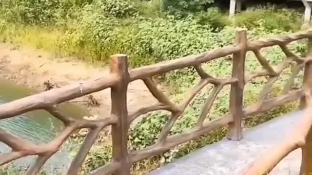 Cement fence handmade to look like tree trunks