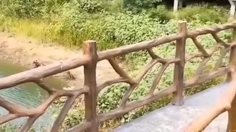 Cement fence handmade to look like tree trunks