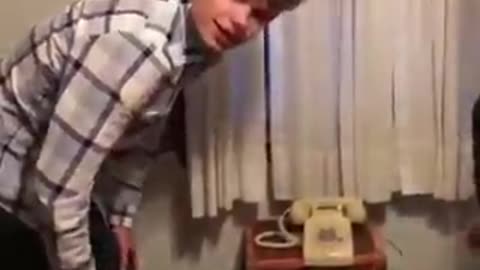 Trying To Make Phone Call On Ancient Apparatus