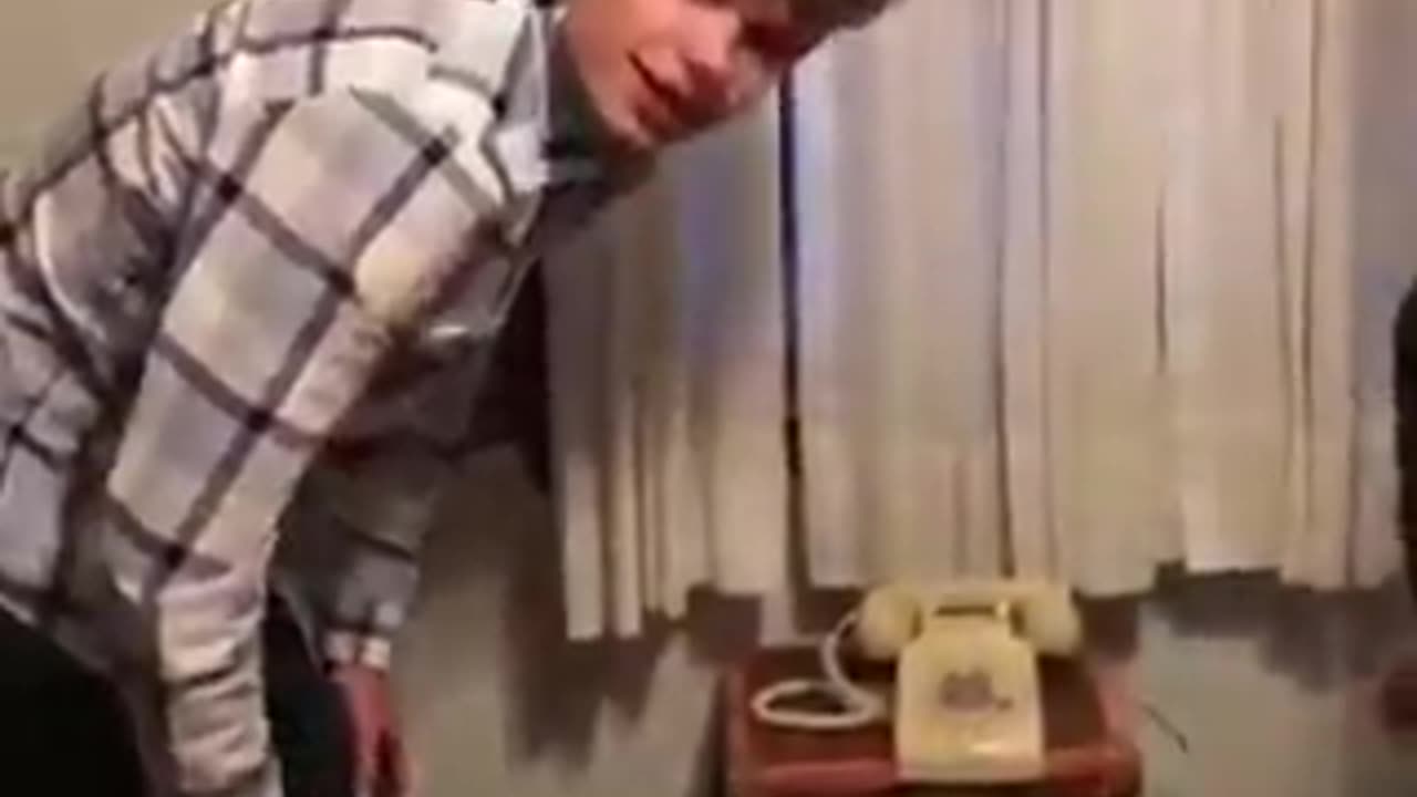 Trying To Make Phone Call On Ancient Apparatus