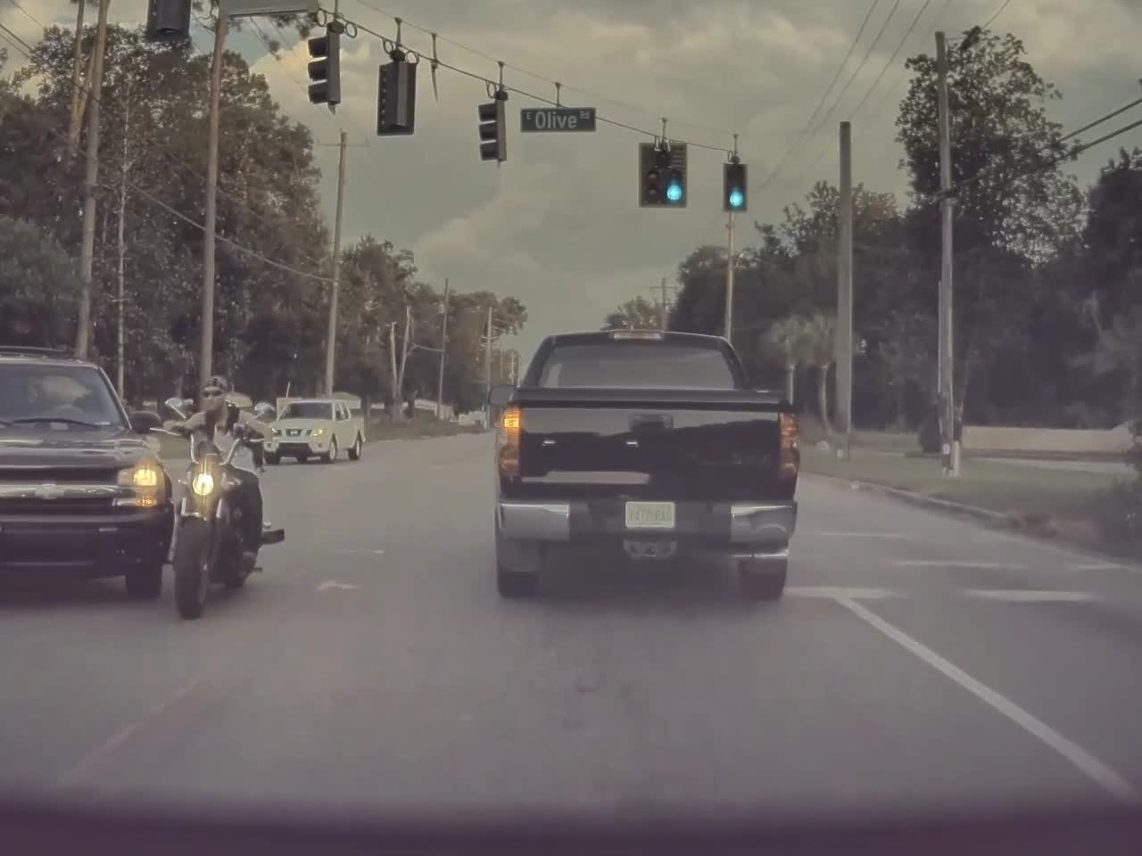 Motorcycle Rips Bumper Bar Clean off Car in Extremely Close Call