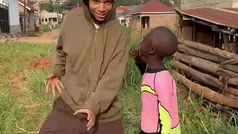 A Black little boy Funny Dance