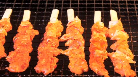 Flaming meat skewers