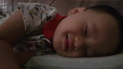 Baby smiling white sleeping