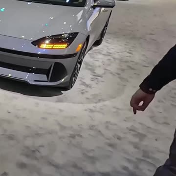 The New Model Electric Car: Sliding Console & Unique Seats