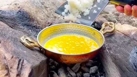 Fried trout on a stone in the forest