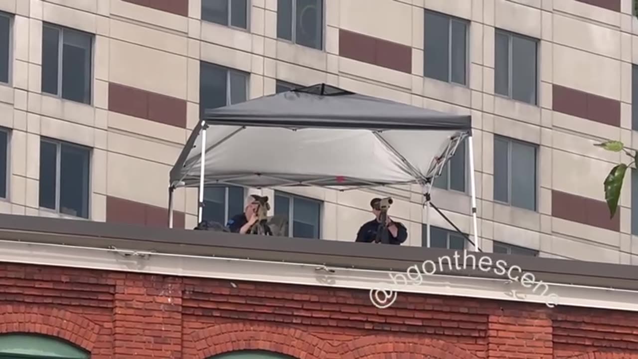 On one of the rooftops across from the main entrances to the Trump rally today