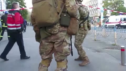 Residents scramble for shelter as blasts rock Kyiv