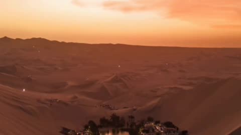 Sunset over an oasis in the Peruvian desert
