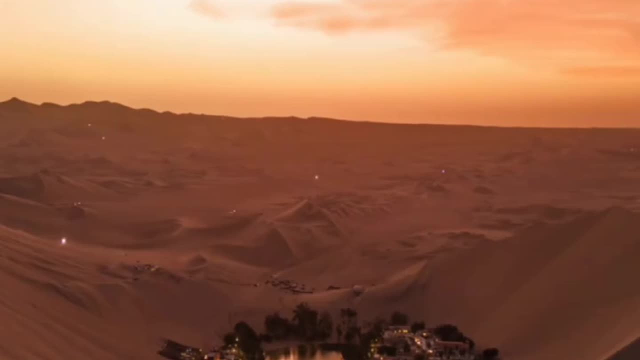 Sunset over an oasis in the Peruvian desert