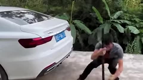 What should you do if the rear wheels of the car fall into a pit