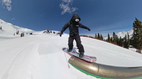 Ollie at Arapahoe Basin Mid mountain park and bump skier jump