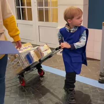 A little boy works as a courier