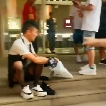 Chinese police threaten a man who's wearing a dress while live streaming on China's TikTok.