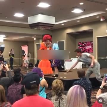 Drag queen teaching a 7-year-old how to be a drag queen and perform for cash tips.