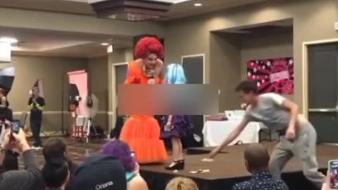 Drag queen teaching a 7-year-old how to be a drag queen and perform for cash tips.